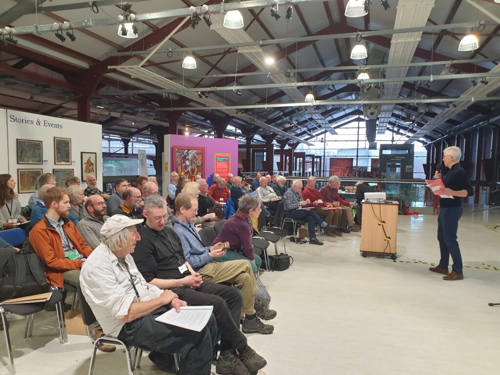 View of conference delegates seated facing a speaker upstairs in the exhibition/events space at Summerlee Museum of Scottish Industrial Life.